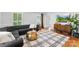 Inviting living room featuring hardwood floors, TV, comfortable seating, and stylish decorations at 3424 Clydesdale Dr, Gastonia, NC 28056