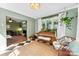 Bright sunroom filled with plants and lots of natural light sits off of the living room at 3424 Clydesdale Dr, Gastonia, NC 28056