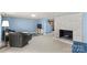 Spacious finished basement featuring seating area, fireplace and tile floors at 366 Faith Rd, Mooresville, NC 28115