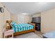 Basement bedroom featuring single bed, side table, and simple neutral decor at 366 Faith Rd, Mooresville, NC 28115