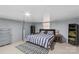 Basement bedroom featuring neutral wall, large bed, and simple modern decor at 366 Faith Rd, Mooresville, NC 28115