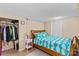 Basement bedroom featuring single bed, closet, and simple neutral decor at 366 Faith Rd, Mooresville, NC 28115