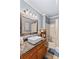 Updated bathroom featuring a large mirror, modern fixtures and tiled floors at 366 Faith Rd, Mooresville, NC 28115