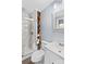 Bright bathroom with glass shower, modern fixtures and built-in wood storage at 366 Faith Rd, Mooresville, NC 28115