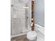 Updated bathroom with a glass shower, modern fixtures and a built-in wood storage shelf at 366 Faith Rd, Mooresville, NC 28115
