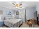 Comfortable bedroom with a ceiling fan, white window blinds and light blue walls at 366 Faith Rd, Mooresville, NC 28115
