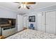 Bedroom featuring a ceiling fan, closet and light blue walls at 366 Faith Rd, Mooresville, NC 28115