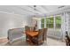 Bright dining area with a wood table, woven chairs, and natural light, creating an inviting space for meals at 366 Faith Rd, Mooresville, NC 28115