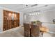 Dining room with a brick accent wall, a wine rack, and a stylish dining table with woven chairs at 366 Faith Rd, Mooresville, NC 28115
