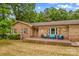 Charming brick home featuring a cozy front porch with outdoor seating and a well-manicured lawn at 366 Faith Rd, Mooresville, NC 28115