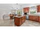 Bright kitchen with a central island, granite countertops, stainless steel appliances, and an adjacent dining area at 366 Faith Rd, Mooresville, NC 28115