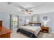 Calm main bedroom featuring a ceiling fan, two windows, and matching nightstands, offering a serene retreat at 366 Faith Rd, Mooresville, NC 28115