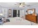 Comfortable main bedroom featuring a ceiling fan, dresser and neutral paint at 366 Faith Rd, Mooresville, NC 28115