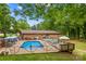 Backyard featuring an inviting in-ground pool, perfect for entertaining and relaxing during warm weather at 366 Faith Rd, Mooresville, NC 28115