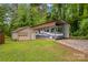 RV parking and detached garage on a private lot surrounded by mature trees at 366 Faith Rd, Mooresville, NC 28115