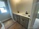 The bathroom features a double vanity with modern light fixture above the mirror at 4017 Grommet Ct, Matthews, NC 28105