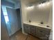 The bathroom features a double vanity with modern light fixture above the mirror at 4017 Grommet Ct, Matthews, NC 28105