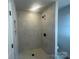This bathroom features a tiled shower with a modern shower head and shelving niche at 4017 Grommet Ct, Matthews, NC 28105