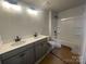 Bright bathroom with a double sink vanity, toilet, and shower and tub combination at 4017 Grommet Ct, Matthews, NC 28105