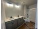 Bright bathroom with a double sink vanity, toilet, and shower and tub combination at 4017 Grommet Ct, Matthews, NC 28105