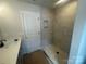 This bathroom features a tiled shower and a single vanity with black fixtures at 4017 Grommet Ct, Matthews, NC 28105