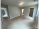 A bedroom with neutral walls shows 3 doorways providing access to other rooms at 4017 Grommet Ct, Matthews, NC 28105