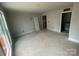 Spacious bedroom featuring neutral walls, unfinished flooring, window, and closet at 4017 Grommet Ct, Matthews, NC 28105