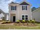 Charming two-story home with stone accents, inviting entry and beautifully landscaped front yard at 4017 Grommet Ct, Matthews, NC 28105