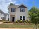 Charming two-story home with gray siding, black shutters, and a well-manicured lawn at 4017 Grommet Ct, Matthews, NC 28105