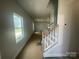 Hallway and staircase leading to the upper level at 4017 Grommet Ct, Matthews, NC 28105