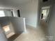 Hallway featuring light gray walls connecting to various rooms on the second floor at 4017 Grommet Ct, Matthews, NC 28105