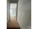 Hallway view, leading to a bright room, offering a glimpse of open space at 4017 Grommet Ct, Matthews, NC 28105