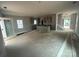 Open-concept space features a kitchen island and staircase, emphasizing spacious design at 4017 Grommet Ct, Matthews, NC 28105
