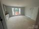 Bright room with large windows and unfinished cabinets, bathed in natural light at 4017 Grommet Ct, Matthews, NC 28105