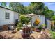 Cozy backyard retreat with comfortable seating, shaded by an umbrella, perfect for relaxation and outdoor enjoyment at 404 N Laurel St, Lincolnton, NC 28092