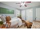 Comfortable bedroom with a single bed, two closets, hardwood floors, and natural light at 404 N Laurel St, Lincolnton, NC 28092