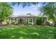 Charming home featuring a lush front yard and inviting curb appeal with landscaped garden beds and a cozy front porch at 404 N Laurel St, Lincolnton, NC 28092