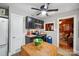 Cozy kitchen with stainless appliances, black cabinetry, an island and an open doorway to an adjacent living space at 404 N Laurel St, Lincolnton, NC 28092