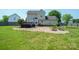 Large, grassy backyard with a patio, fire pit, and lovely home exterior, perfect for entertaining at 4301 Windjammer Sw Ct, Concord, NC 28027