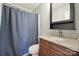 The bathroom features a shower with a shower curtain and a granite countertop at 4301 Windjammer Sw Ct, Concord, NC 28027