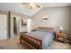 This bedroom has a ceiling fan and neutral paint at 4301 Windjammer Sw Ct, Concord, NC 28027