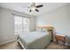 This bedroom features a ceiling fan and plenty of natural light at 4301 Windjammer Sw Ct, Concord, NC 28027