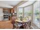Cozy dining area with natural light, wooden table, and a view of the backyard at 4301 Windjammer Sw Ct, Concord, NC 28027