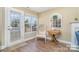Cozy spot with hardwood floors, lots of natural light, and neutral decor, near the fireplace at 4301 Windjammer Sw Ct, Concord, NC 28027