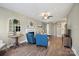 Bright living room featuring wood floors, a fireplace, comfortable seating, and natural light at 4301 Windjammer Sw Ct, Concord, NC 28027