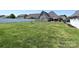 Large backyard with ample lawn space, a patio, and fencing, offering great outdoor potential at 4562 Lanstone Sw Ct, Concord, NC 28027