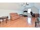 Bonus room with a sloped ceiling, hardwood floors, sitting area, desk, and exercise machine at 4562 Lanstone Sw Ct, Concord, NC 28027