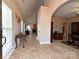 Spacious tiled foyer with high ceilings and an arched doorway leading to the living area at 4562 Lanstone Sw Ct, Concord, NC 28027