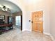 Welcoming foyer with a wooden door and tiled flooring, offering a glimpse into the office space at 4562 Lanstone Sw Ct, Concord, NC 28027