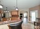 An eat-in kitchen featuring light wood cabinets, granite counters and open access to other rooms at 4562 Lanstone Sw Ct, Concord, NC 28027